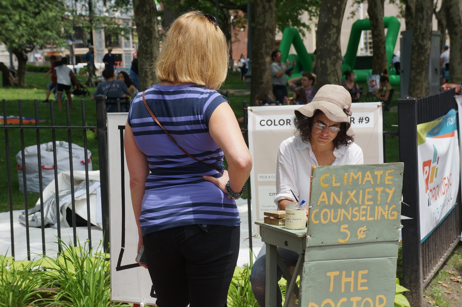 Kate Shapira at the Climate Anxiety Counseling booth in Kennedy Plaza