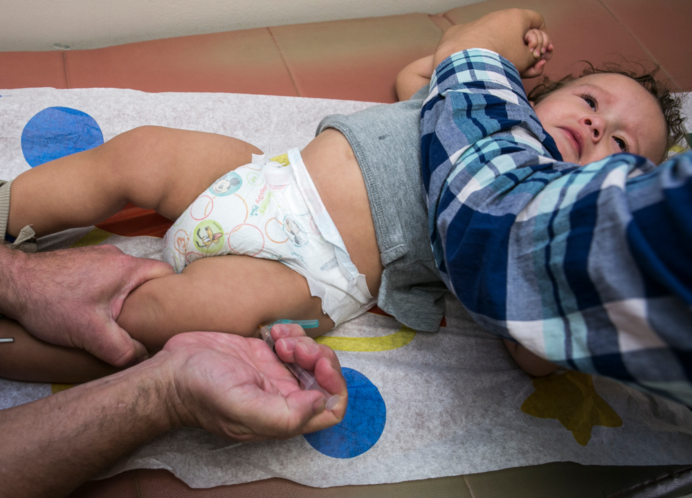 FILE - In this Jan. 29, 2015, file photo, pediatrician Charles Goodman vaccinates 1-year-old Cameron Fierro with the measles-mumps-rubella vaccine, or MMR vaccine, at his practice in Northridge, Calif. A new study published in the journal Science suggests the measles vaccine not only prevents measles, but may also help the body ward off other infections. State health officials say the number of measles cases is up in California this year and much of the increase is linked to overseas travel. Dr. Karen Smith, director of the California Department of Public Health, says the state recorded 38 measles cases as of Thursday, April 25, 2019, versus 11 around the same time last year. She says the state typically sees fewer than two dozen cases a year. (AP Photo/Damian Dovarganes,File) FILE - In this Jan. 29, 2015, file photo, pediatrician Charles Goodman vaccinates 1-year-old Cameron Fierro with the measles-mumps-rubella vaccine, or MMR vaccine, at his practice in Northridge, Calif. A new study published in the journal Science suggests the measles vaccine not only prevents measles, but may also help the body ward off other infections. State health officials say the number of measles cases is up in California this year and much of the increase is linked to overseas travel. Dr. Karen Smith, director of the California Department of Public Health, says the state recorded 38 measles cases as of Thursday, April 25, 2019, versus 11 around the same time last year. She says the state typically sees fewer than two dozen cases a year. (AP Photo/Damian Dovarganes,File)