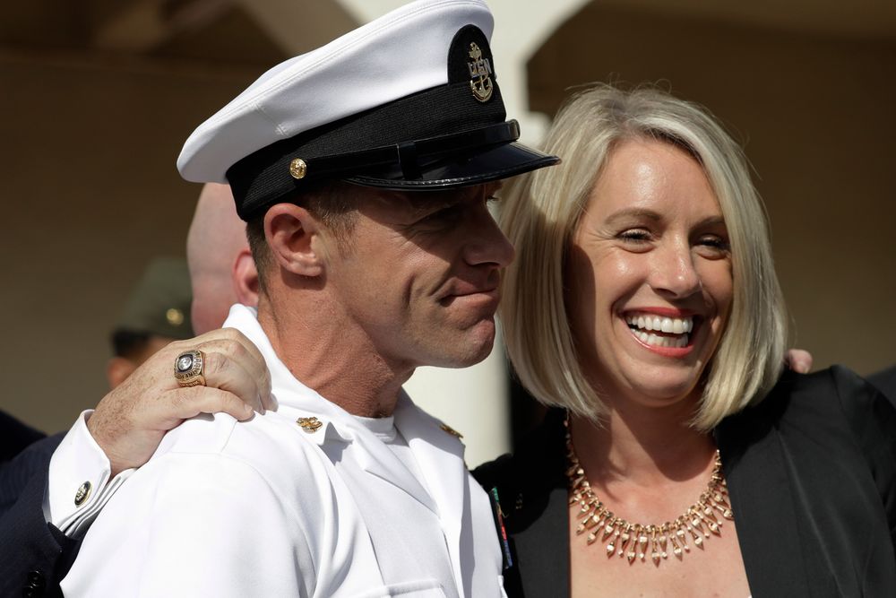Navy Special Operations Chief Edward Gallagher, left, and his wife, Andrea Gallagher smile, after leaving a military court on Naval Base San Diego, Tuesday, July 2, 2019, in San Diego. A military jury acquitted the decorated Navy SEAL Tuesday of murder in the killing of a wounded Islamic State captive under his care in Iraq in 2017. (AP Photo/Gregory Bull) Navy Special Operations Chief Edward Gallagher, left, and his wife, Andrea Gallagher smile, after leaving a military court on Naval Base San Diego, Tuesday, July 2, 2019, in San Diego. A military jury acquitted the decorated Navy SEAL Tuesday of murder in the killing of a wounded Islamic State captive under his care in Iraq in 2017. (AP Photo/Gregory Bull)