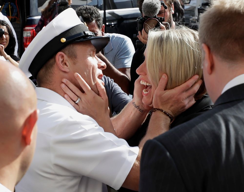 Navy Special Operations Chief Edward Gallagher, left, hugs his wife, Andrea Gallagher after leaving a military court on Naval Base San Diego, Tuesday, July 2, 2019, in San Diego. A military jury acquitted the decorated Navy SEAL Tuesday of murder in the killing of a wounded Islamic State captive under his care in Iraq in 2017. (AP Photo/Gregory Bull) Navy Special Operations Chief Edward Gallagher, left, hugs his wife, Andrea Gallagher after leaving a military court on Naval Base San Diego, Tuesday, July 2, 2019, in San Diego. A military jury acquitted the decorated Navy SEAL Tuesday of murder in the killing of a wounded Islamic State captive under his care in Iraq in 2017. (AP Photo/Gregory Bull)