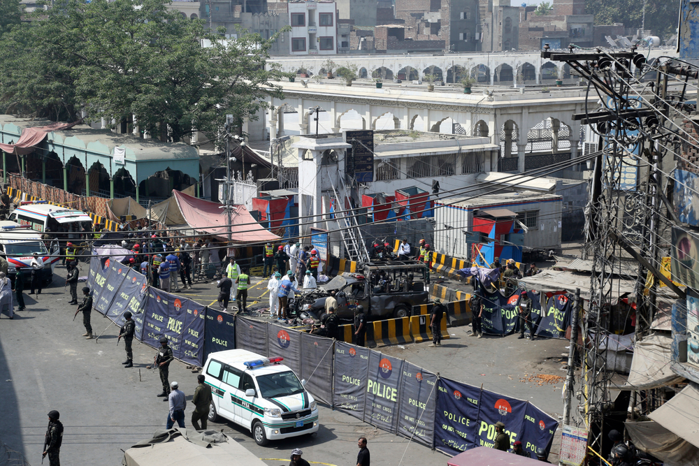 Pakistani security personnel cordon off a damaged police van in Lahore, Pakistan, Wednesday, May 8, 2019. A powerful bomb exploded near security forces guarding a famous Sufi shrine in Pakistan on Wednesday, police said. (AP Photo/K.M. Chaudary) Pakistani security personnel cordon off a damaged police van in Lahore, Pakistan, Wednesday, May 8, 2019. A powerful bomb exploded near security forces guarding a famous Sufi shrine in Pakistan on Wednesday, police said. (AP Photo/K.M. Chaudary)