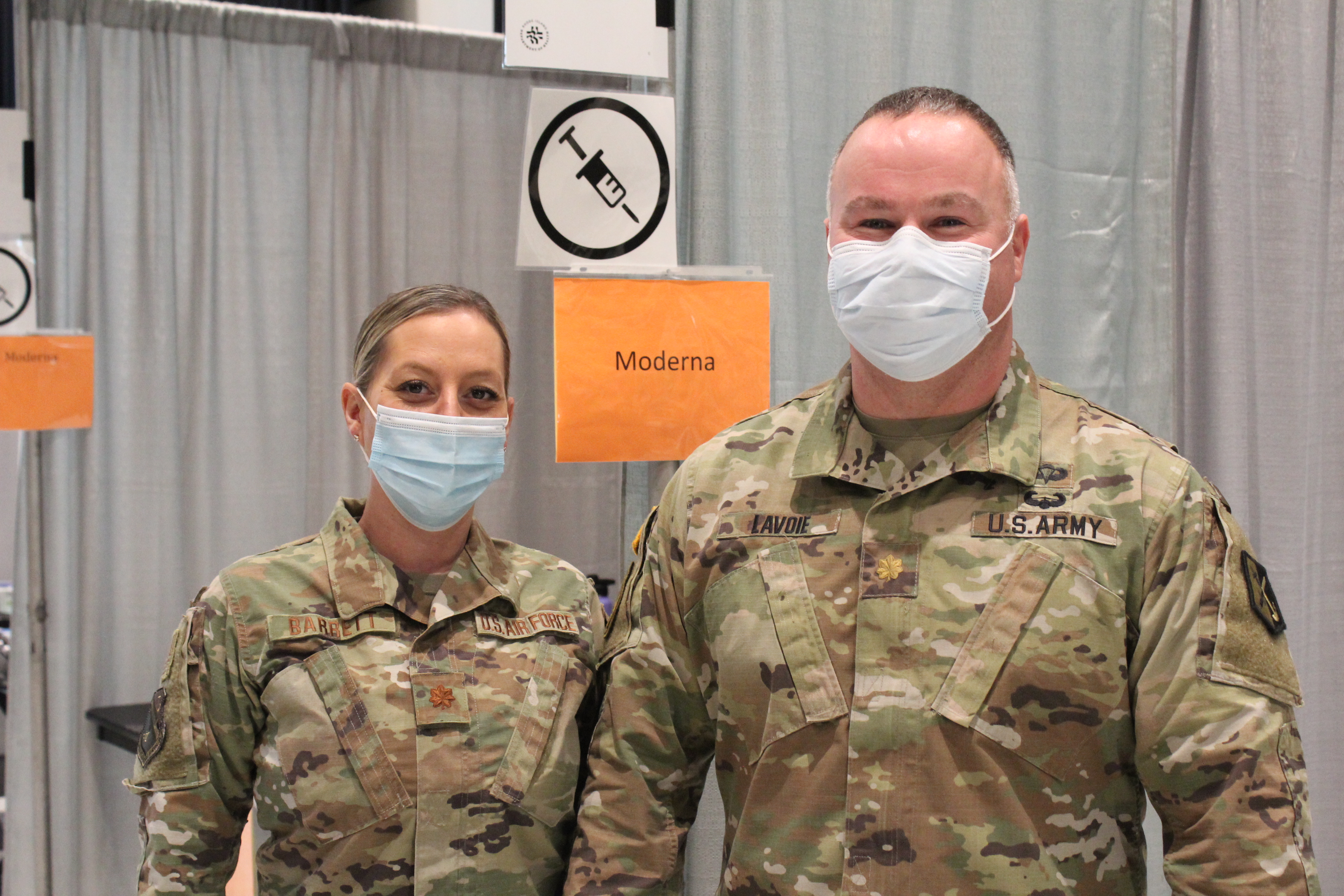 Major Joanne Barrett and Major Matthew Lavoie are working at the new vaccine site at the Rhode Island Convention Center, which opened this winter as COVID cases surged in the state.