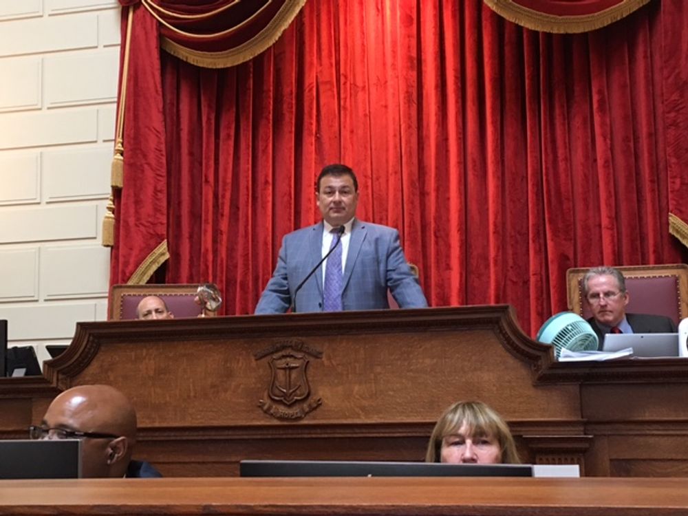Shekarchi at the rostrum in 2021.
