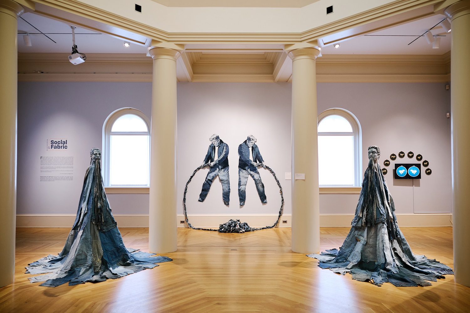 Installation view of Jim Arendt Eryks and Totemic Figures in “Social Fabric: Textiles and Contemporary Issues”