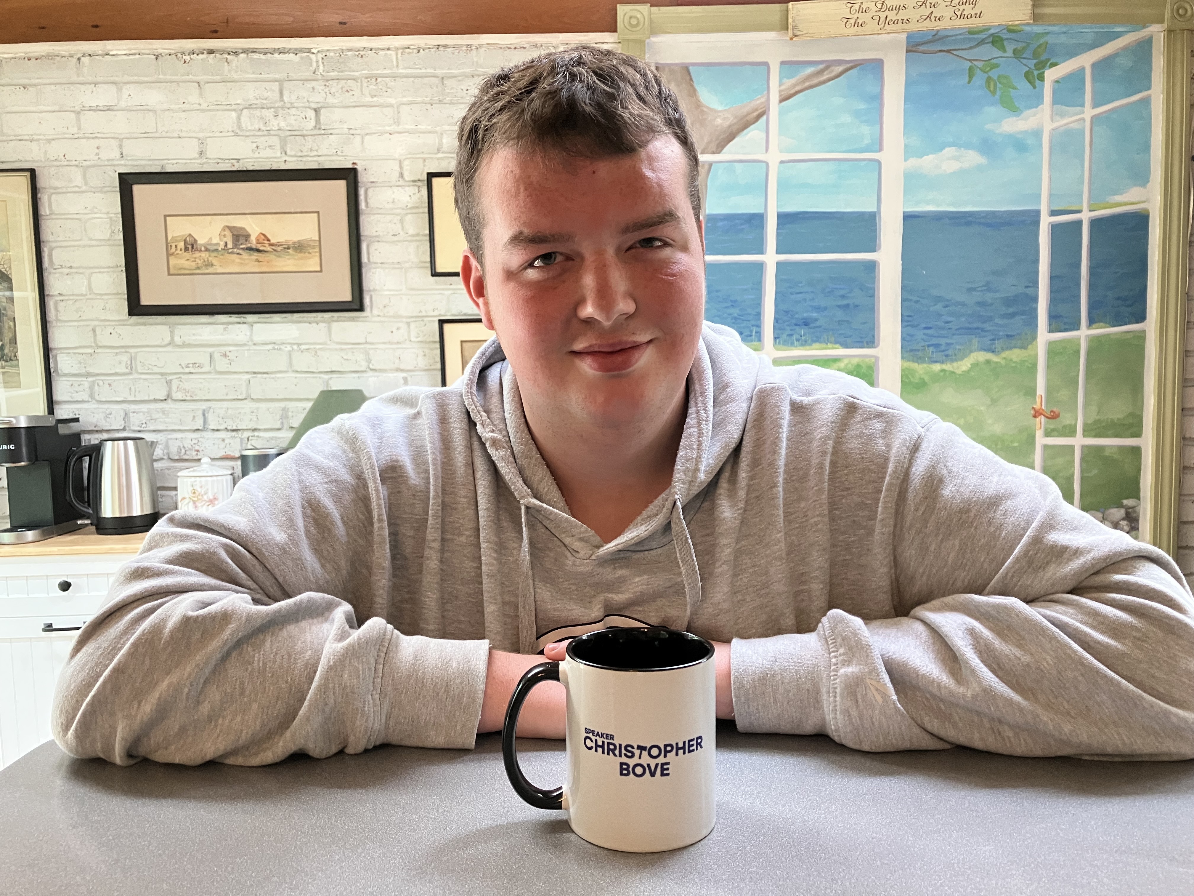 Chris Bove has a coffee mug that features his title as secretary of the student senate at URI. Planning a career in public service, Bove had internships in the offices of Senator Sheldon Whitehouse and former congressman David Cicilline during the summer of 2022. 