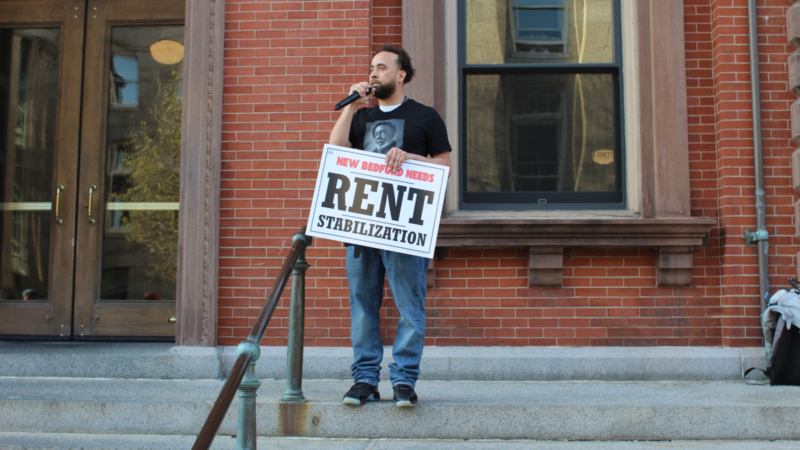 Activist Erik Andrade convened a rally before Thursday's vote on rent stabilization.