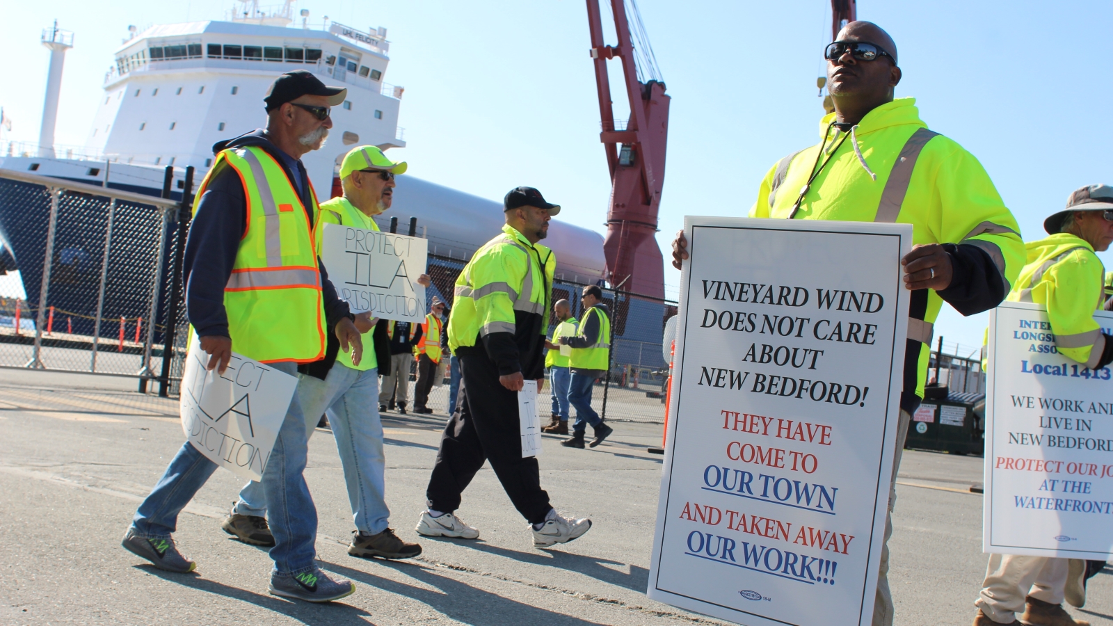 Lawrence Matthews Jr., a longshoreman in New Bedford, pickets outside of a pier where workers were unloading turbine components for the nation's first major offshore wind farm.