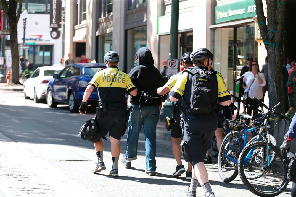 A protestor is taken into custody by police as demonstrators from at least three groups, including members of the so-called Proud Boys and anti-fascist groups, that had planned rallies or demonstrations at different sites in the city gathered, Saturday, June 29, 2019, in Portland, Ore. Competing demonstrations spilled into the streets of downtown Portland, with fights breaking out in places as marchers clashed. (Dave Killen/The Oregonian via AP) A protestor is taken into custody by police as demonstrators from at least three groups, including members of the so-called Proud Boys and anti-fascist groups, that had planned rallies or demonstrations at different sites in the city gathered, Saturday, June 29, 2019, in Portland, Ore. Competing demonstrations spilled into the streets of downtown Portland, with fights breaking out in places as marchers clashed. (Dave Killen/The Oregonian via AP)