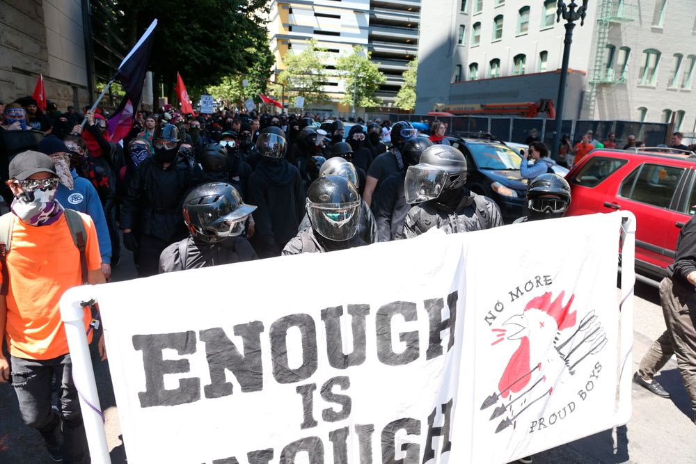 Multiple groups, including Rose City Antifa, the Proud Boys and conservative activist Haley Adams protest in downtown Portland, Ore., Saturday, June 29, 2019. (Dave Killen/The Oregonian via AP) Multiple groups, including Rose City Antifa, the Proud Boys and conservative activist Haley Adams protest in downtown Portland, Ore., Saturday, June 29, 2019. (Dave Killen/The Oregonian via AP)