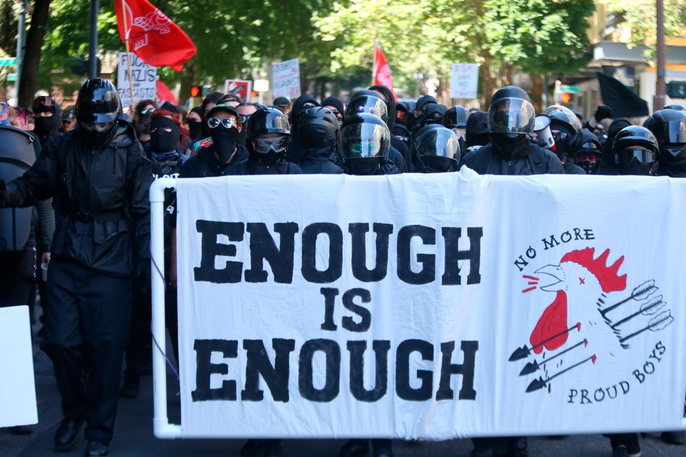 Multiple groups, including Rose City Antifa, the Proud Boys and conservative activist Haley Adams protest in downtown Portland, Ore., Saturday, June 29, 2019. (Dave Killen/The Oregonian via AP) Multiple groups, including Rose City Antifa, the Proud Boys and conservative activist Haley Adams protest in downtown Portland, Ore., Saturday, June 29, 2019. (Dave Killen/The Oregonian via AP)