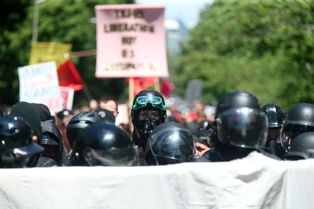 Multiple groups, including Rose City Antifa, the Proud Boys and conservative activist Haley Adams protest in downtown Portland, Ore., Saturday, June 29, 2019. (Dave Killen/The Oregonian via AP) Multiple groups, including Rose City Antifa, the Proud Boys and conservative activist Haley Adams protest in downtown Portland, Ore., Saturday, June 29, 2019. (Dave Killen/The Oregonian via AP)