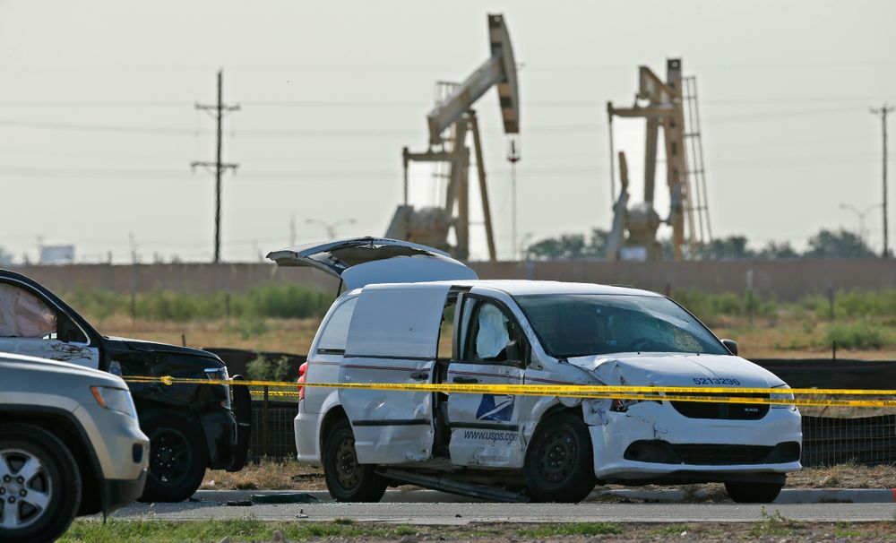 A U.S. Mail vehicle, right, which was involved in Saturday's shooting, is pictured outside the Cinergy entertainment center Sunday, Sept. 1, 2019, in Odessa, Texas. The death toll in the West Texas shooting rampage increased Sunday as authorities investigated why a man stopped by state troopers for failing to signal a left turn opened fire on them and fled, shooting over a dozen people as he drove before being killed by officers outside a movie theater. A police vehicle is partially blocked at left. (AP Photo/Sue Ogrocki) A U.S. Mail vehicle, right, which was involved in Saturday's shooting, is pictured outside the Cinergy entertainment center Sunday, Sept. 1, 2019, in Odessa, Texas. The death toll in the West Texas shooting rampage increased Sunday as authorities investigated why a man stopped by state troopers for failing to signal a left turn opened fire on them and fled, shooting over a dozen people as he drove before being killed by officers outside a movie theater. A police vehicle is partially blocked at left. (AP Photo/Sue Ogrocki)