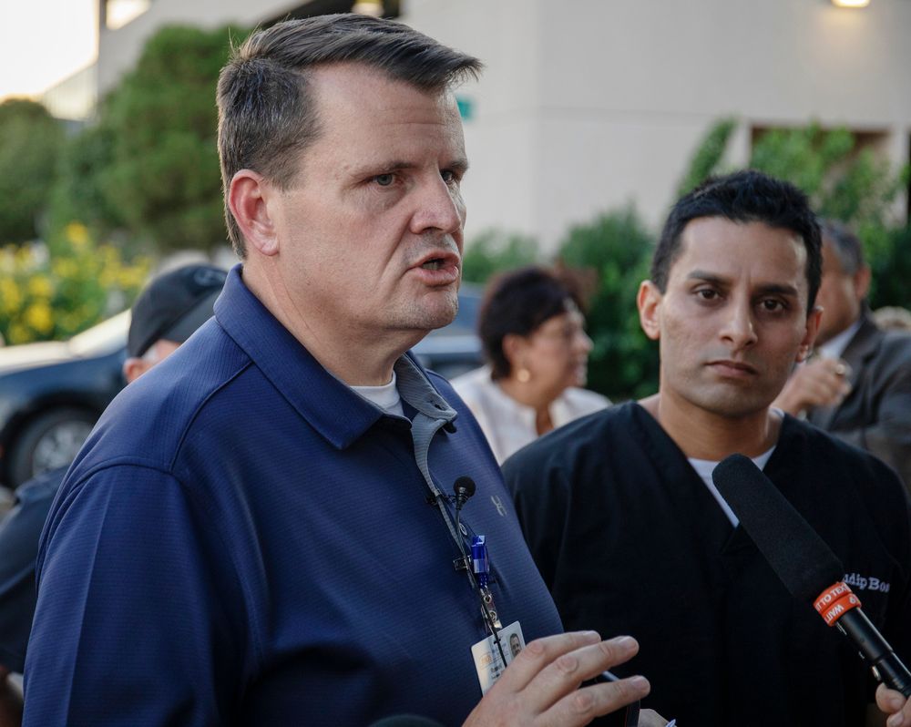 Russell Tippin, CEO of Medical Center Hospital in Odessa, speaks to reporters outside the hospital in Odessa, Texas, Saturday, Aug. 31, 2019, following a deadly shooting. Several people were dead after a gunman who hijacked a postal service vehicle in West Texas shot more than 20 people, authorities said Saturday. The gunman was killed and a few law enforcement officers were among the injured. (Jacy Lewis/Reporter-Telegram via AP) Russell Tippin, CEO of Medical Center Hospital in Odessa, speaks to reporters outside the hospital in Odessa, Texas, Saturday, Aug. 31, 2019, following a deadly shooting. Several people were dead after a gunman who hijacked a postal service vehicle in West Texas shot more than 20 people, authorities said Saturday. The gunman was killed and a few law enforcement officers were among the injured. (Jacy Lewis/Reporter-Telegram via AP)