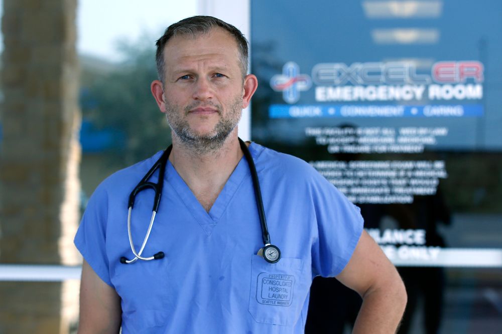 Dr. Nathaniel B. Ott, M.D. poses for a photo outside EXCELER emergency room Sunday, Sept. 1, 2019, in Odessa, Texas. Ott attended to one of Saturday's shooting outside his center. (AP Photo/Sue Ogrocki) Dr. Nathaniel B. Ott, M.D. poses for a photo outside EXCELER emergency room Sunday, Sept. 1, 2019, in Odessa, Texas. Ott attended to one of Saturday's shooting outside his center. (AP Photo/Sue Ogrocki)