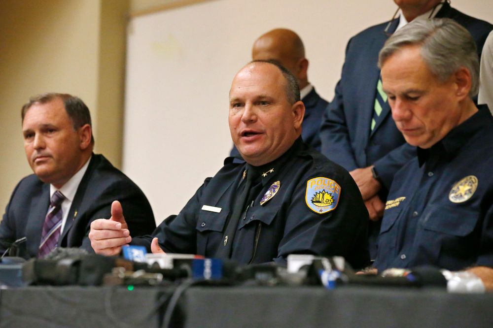 Odessa Police Chief Michael Gerke, center, answers a question concerning Saturday's shooting during a news conference Sunday, Sept. 1, 2019, in Odessa, Texas. From left are Christopher Combs, FBI Special Agent in Charge, San Antonio, Gerke, and Texas Governor Greg Abbott. (AP Photo/Sue Ogrocki) Odessa Police Chief Michael Gerke, center, answers a question concerning Saturday's shooting during a news conference Sunday, Sept. 1, 2019, in Odessa, Texas. From left are Christopher Combs, FBI Special Agent in Charge, San Antonio, Gerke, and Texas Governor Greg Abbott. (AP Photo/Sue Ogrocki)