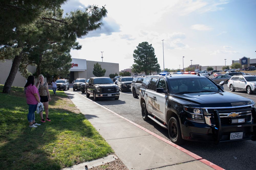 Odessa police officers park their vehicles outside Music City Mall in Odessa, Texas, Saturday, Aug. 31, 2019, as they investigate areas following a deadly shooting in the area of Odessa and Midland. Several people were dead after a gunman who hijacked a postal service vehicle in West Texas shot more than 20 people, authorities said Saturday. The gunman was killed and a few law enforcement officers were among the injured. (Jacy Lewis/Reporter-Telegram via AP) Odessa police officers park their vehicles outside Music City Mall in Odessa, Texas, Saturday, Aug. 31, 2019, as they investigate areas following a deadly shooting in the area of Odessa and Midland. Several people were dead after a gunman who hijacked a postal service vehicle in West Texas shot more than 20 people, authorities said Saturday. The gunman was killed and a few law enforcement officers were among the injured. (Jacy Lewis/Reporter-Telegram via AP)