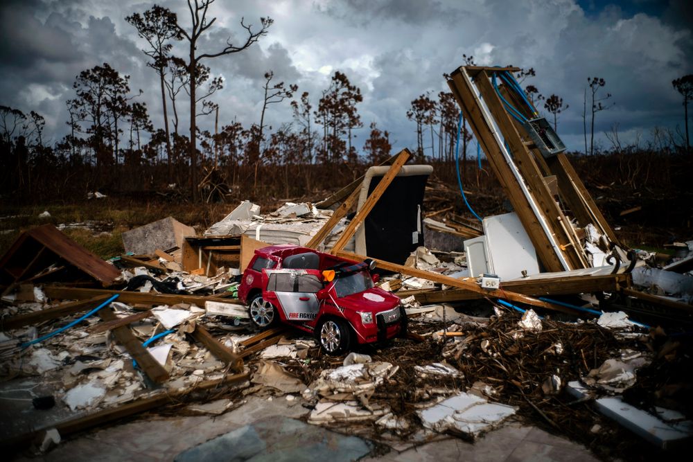 A toy fire engine sits in the rubble of a house destroyed by Hurricane Dorian in Gold Rock Creek, Grand Bahama, Bahamas, Thursday Sept. 12, 2019. Nearly two weeks after Hurricane Dorian hit the northern Bahamas, people continue to scan social media, peer under rubble or follow the smell of death in an attempt to find family and friends. (AP Photo/Ramon Espinosa) A toy fire engine sits in the rubble of a house destroyed by Hurricane Dorian in Gold Rock Creek, Grand Bahama, Bahamas, Thursday Sept. 12, 2019. Nearly two weeks after Hurricane Dorian hit the northern Bahamas, people continue to scan social media, peer under rubble or follow the smell of death in an attempt to find family and friends. (AP Photo/Ramon Espinosa)