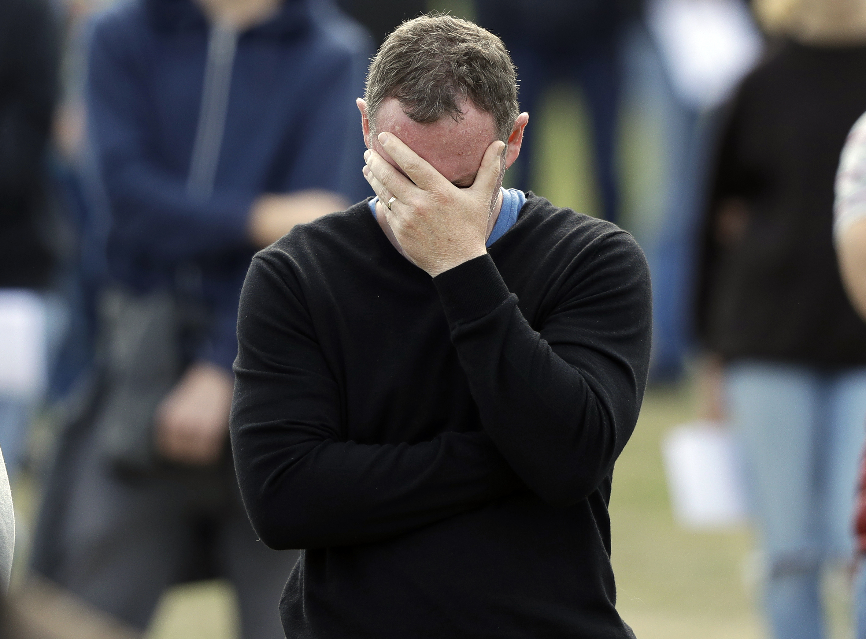 A man reacts during a national remembrance service in Hagley Park for the victims of the March 15 mosque terrorist attack in Christchurch, New Zealand, Friday, March 29, 2019. (AP Photo/Mark Baker) A man reacts during a national remembrance service in Hagley Park for the victims of the March 15 mosque terrorist attack in Christchurch, New Zealand, Friday, March 29, 2019. (AP Photo/Mark Baker)