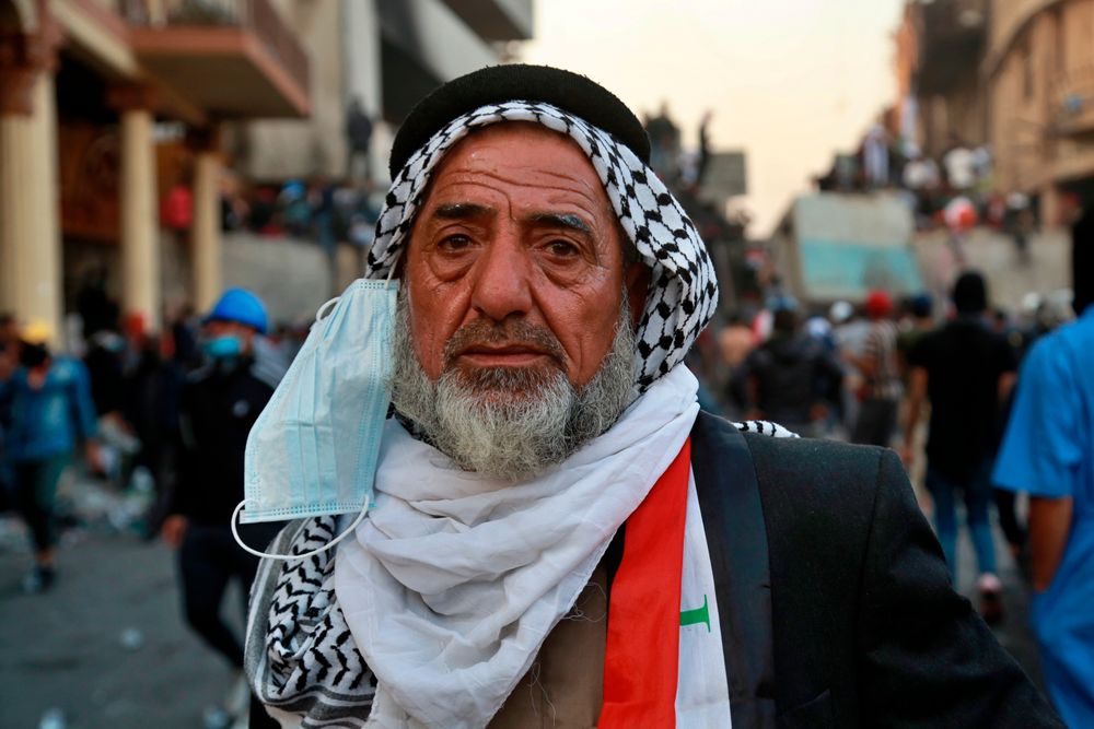 An elderly man takes part in anti-government protesters at the historic Rasheed Street in Baghdad, Iraq, Sunday, Nov. 24, 2019. At least 342 people have died since demonstrations began Oct. 1, when thousands of Iraqis, mostly youth, took to the streets to decry corruption and poor services. The leaderless uprising seeks to overthrow the political establishment. (AP Photo/Khalid Mohammed) An elderly man takes part in anti-government protesters at the historic Rasheed Street in Baghdad, Iraq, Sunday, Nov. 24, 2019. At least 342 people have died since demonstrations began Oct. 1, when thousands of Iraqis, mostly youth, took to the streets to decry corruption and poor services. The leaderless uprising seeks to overthrow the political establishment. (AP Photo/Khalid Mohammed)