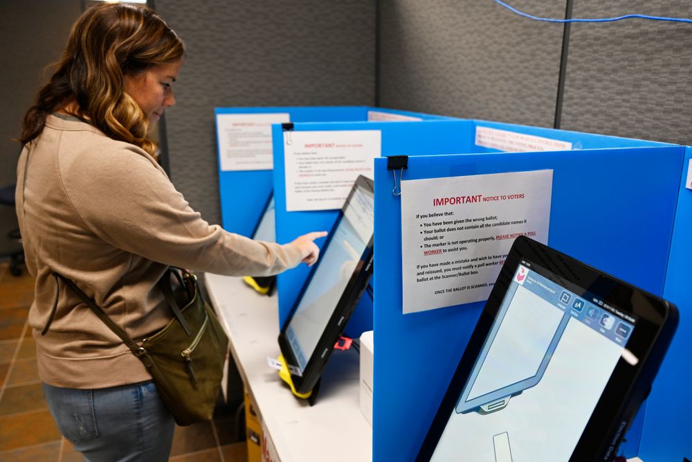 Courtney Parker votes on a new voting machine, Tuesday, Nov. 5, 2019, in Dallas, Ga. New voting machines that combine touchscreens with paper ballots are getting a limited test run in Georgia, as officials rush to meet a court-ordered deadline to retire the old system before any votes are cast in 2020. (AP Photo/Mike Stewart) Courtney Parker votes on a new voting machine, Tuesday, Nov. 5, 2019, in Dallas, Ga. New voting machines that combine touchscreens with paper ballots are getting a limited test run in Georgia, as officials rush to meet a court-ordered deadline to retire the old system before any votes are cast in 2020. (AP Photo/Mike Stewart)