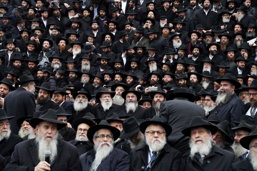 In this Nov. 24, 2019, photo, Hasidic leaders gather for an annual group photo outside of the Chabad-Yubavitch Worldwide headquarters as a part of the International Conference of Chabad-Lubavitch Emissaries in New York. The annual conference included seminars, a class photo of about 5,800 rabbis in attendance and an evening dinner. (AP Photo/Emily Leshner) In this Nov. 24, 2019, photo, Hasidic leaders gather for an annual group photo outside of the Chabad-Yubavitch Worldwide headquarters as a part of the International Conference of Chabad-Lubavitch Emissaries in New York. The annual conference included seminars, a class photo of about 5,800 rabbis in attendance and an evening dinner. (AP Photo/Emily Leshner)