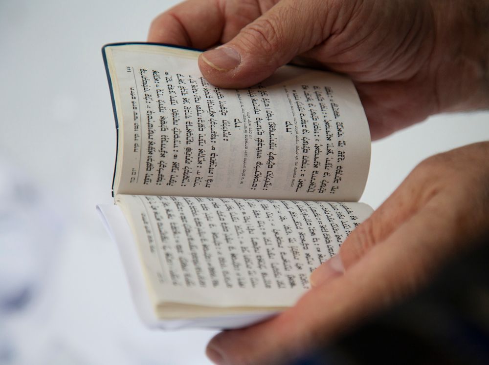 In this Nov. 22, 2019, photo, a Hasidic leader reads a prayer at the resting place of the late Rabbi Menachem Mendel Schneerson, known as the Lubavitcher Rebbe, while attending the annual International Conference of Chabad-Lubavitch Emissaries at Montefiore Cemetery in New York. The annual conference included seminars, a class photo of about 5,800 rabbis in attendance and an evening dinner. (AP Photo/Jessie Wardarski) In this Nov. 22, 2019, photo, a Hasidic leader reads a prayer at the resting place of the late Rabbi Menachem Mendel Schneerson, known as the Lubavitcher Rebbe, while attending the annual International Conference of Chabad-Lubavitch Emissaries at Montefiore Cemetery in New York. The annual conference included seminars, a class photo of about 5,800 rabbis in attendance and an evening dinner. (AP Photo/Jessie Wardarski)