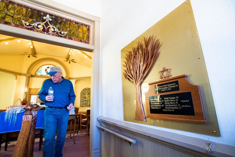 Temple president Michael Atlas-Acuña walks past a memorial inside the historic Temple Emanuel in Pueblo, Colo., for the victims of the 2018 Aytz Chaim Synagogue shooting in Pittsburg, Pa., Tuesday, Nov. 5, 2019. Richard Holzer, 27, of Pueblo was arrested Friday by the FBI after he allegedly said he was going to go blow up the temple because he hates Jews. (Christian Murdock/The Gazette via AP) Temple president Michael Atlas-Acuña walks past a memorial inside the historic Temple Emanuel in Pueblo, Colo., for the victims of the 2018 Aytz Chaim Synagogue shooting in Pittsburg, Pa., Tuesday, Nov. 5, 2019. Richard Holzer, 27, of Pueblo was arrested Friday by the FBI after he allegedly said he was going to go blow up the temple because he hates Jews. (Christian Murdock/The Gazette via AP)