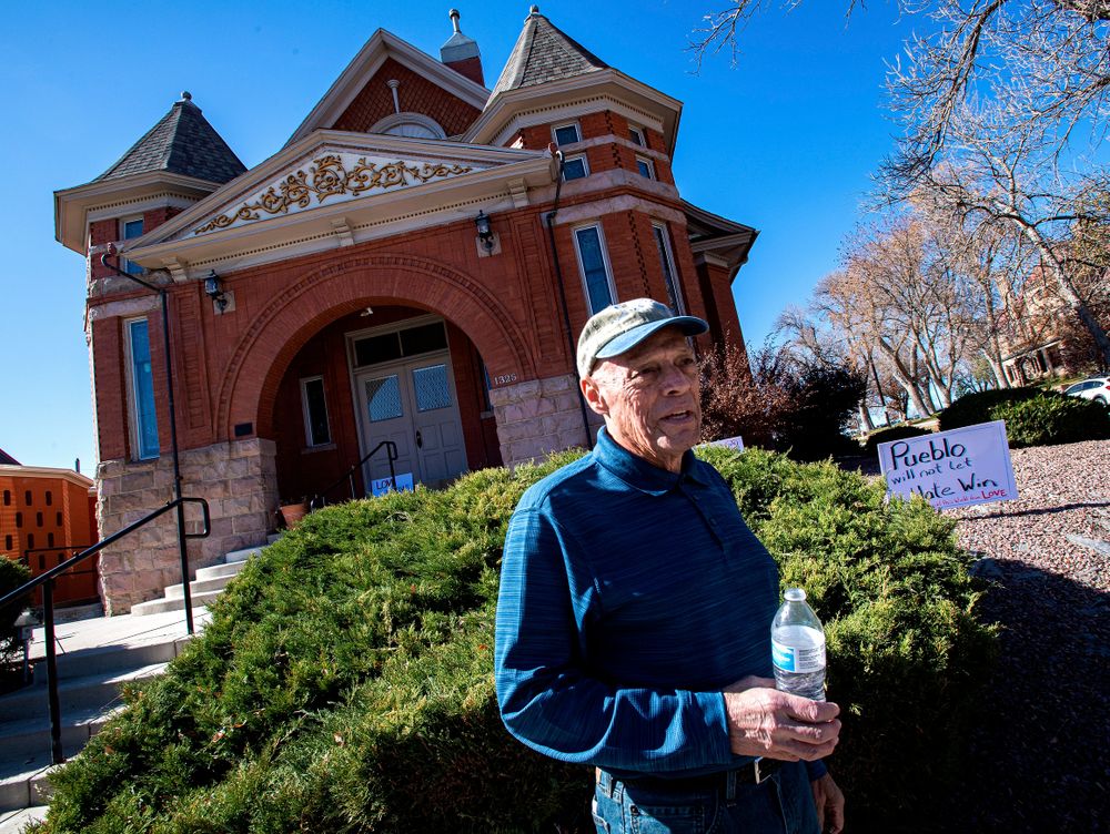Temple president Michael Atlas-Acuña found signs, flowers and candles expressing love for the Jewish community when he arrived at the historic Temple Emanuel in Pueblo, Colo., Tuesday morning, Nov. 5, 2019. Richard Holzer, 27, of Pueblo was arrested Friday by the FBI after he allegedly said he was going to go blow up the temple because he hates Jews. (Christian Murdock/The Gazette via AP) Temple president Michael Atlas-Acuña found signs, flowers and candles expressing love for the Jewish community when he arrived at the historic Temple Emanuel in Pueblo, Colo., Tuesday morning, Nov. 5, 2019. Richard Holzer, 27, of Pueblo was arrested Friday by the FBI after he allegedly said he was going to go blow up the temple because he hates Jews. (Christian Murdock/The Gazette via AP)