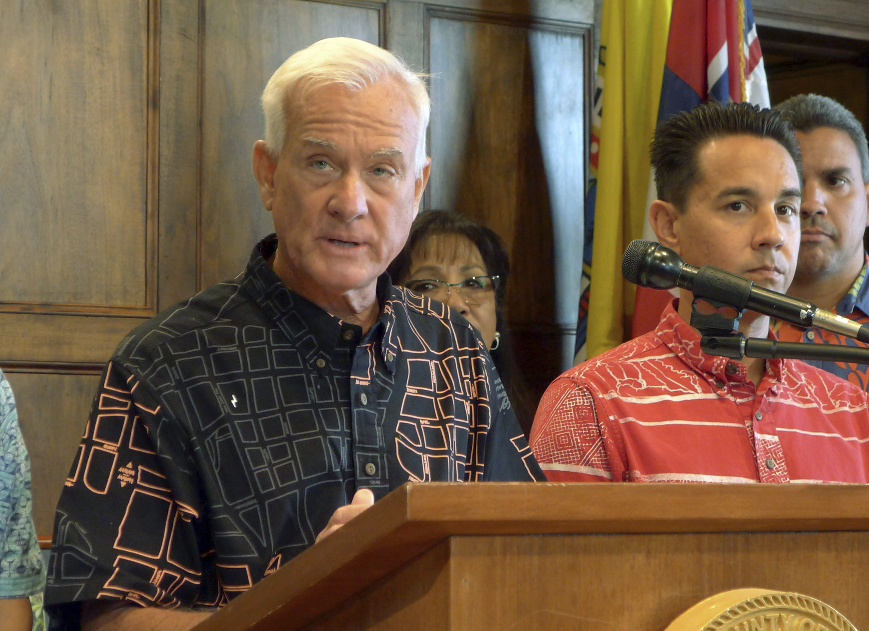 FILE - In this Aug. 28, 2017 file photo, Honolulu Mayor Kirk Caldwell talks to reporters about problems with a rail funding bill in Honolulu. The city of Honolulu's chief legal officer has received a target letter linked to an ongoing federal corruption investigation. Mayor Kirk Caldwell says Corporation Counsel Donna Leong is taking a paid leave of absence, effective Monday, Jan. 14, 2019. (AP Photo/Cathy Bussewitz, File) FILE - In this Aug. 28, 2017 file photo, Honolulu Mayor Kirk Caldwell talks to reporters about problems with a rail funding bill in Honolulu. The city of Honolulu's chief legal officer has received a target letter linked to an ongoing federal corruption investigation. Mayor Kirk Caldwell says Corporation Counsel Donna Leong is taking a paid leave of absence, effective Monday, Jan. 14, 2019. (AP Photo/Cathy Bussewitz, File)