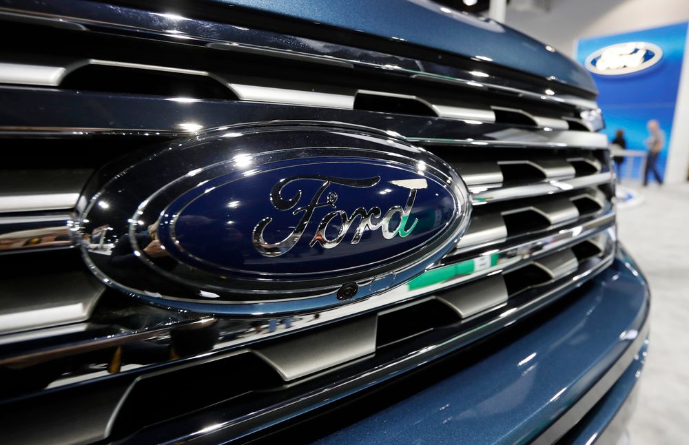 FILE - In this file photo dated Thursday, March 28, 2019, the Ford Motor company logo at the auto show in Denver, USA. Carmaker Ford said Thursday June 27, 2019, it is shedding 12,000 jobs in Europe as it streamlines operations in the region to increase profitability. (AP Photo/David Zalubowski) FILE - In this file photo dated Thursday, March 28, 2019, the Ford Motor company logo at the auto show in Denver, USA. Carmaker Ford said Thursday June 27, 2019, it is shedding 12,000 jobs in Europe as it streamlines operations in the region to increase profitability. (AP Photo/David Zalubowski)