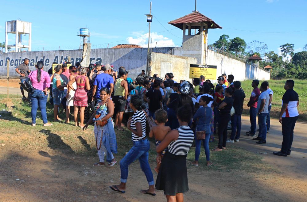 People seek information about family members who are prisoners after a riot inside the Regional Recovery Center in Altamira, Brazil, Monday, July 29, 2019. At least 57 prisoners were killed by other inmates during clashes between organized crime groups in the Altamira prison in northern Brazil Monday with 16 of the victims being decapitated, according to prison officials. (Wilson Soares/Panamazonica via AP) People seek information about family members who are prisoners after a riot inside the Regional Recovery Center in Altamira, Brazil, Monday, July 29, 2019. At least 57 prisoners were killed by other inmates during clashes between organized crime groups in the Altamira prison in northern Brazil Monday with 16 of the victims being decapitated, according to prison officials. (Wilson Soares/Panamazonica via AP)
