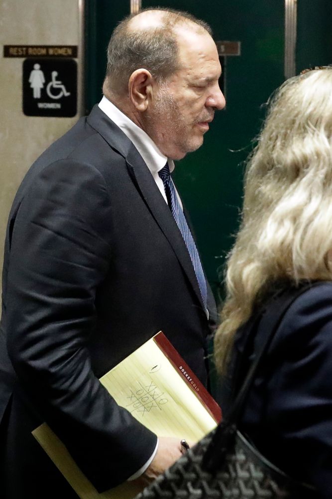 Former movie mogul Harvey Weinstein, carrying a pad with a Tic-Tac-Toe game, leaves State Supreme Court following a hearing related to his sexual assault case, Thursday, July 11, 2019, in New York. Weinstein's lawyer Jose Baez went to court Thursday to get a judge's permission to leave the case, the latest defection from what was once seen as a modern version of O.J. Simpson's Former movie mogul Harvey Weinstein, carrying a pad with a Tic-Tac-Toe game, leaves State Supreme Court following a hearing related to his sexual assault case, Thursday, July 11, 2019, in New York. Weinstein's lawyer Jose Baez went to court Thursday to get a judge's permission to leave the case, the latest defection from what was once seen as a modern version of O.J. Simpson's