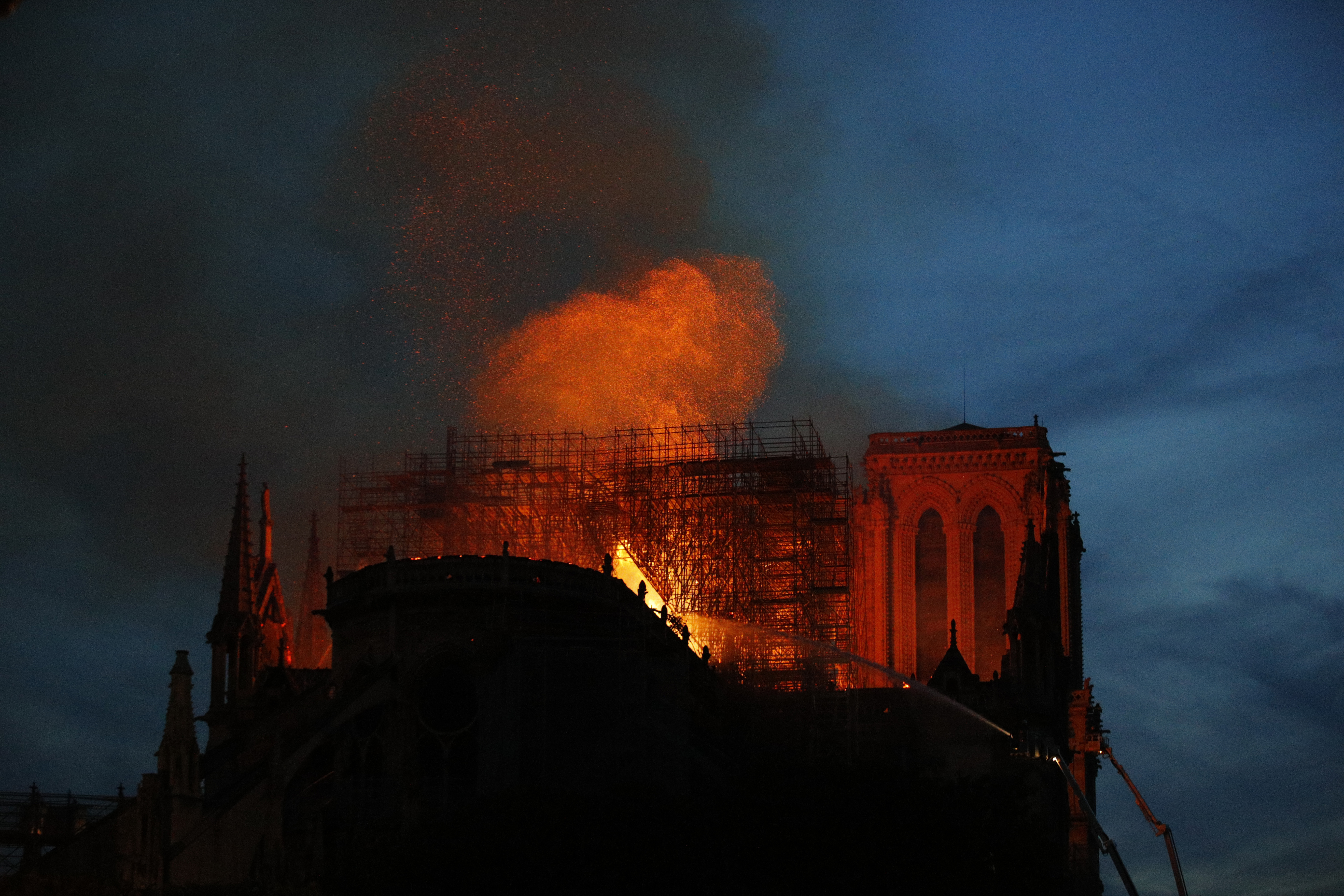 Firefighters use hoses as Notre Dame cathedral burns in Paris, Monday, April 15, 2019. A catastrophic fire engulfed the upper reaches of Paris' soaring Notre Dame Cathedral as it was undergoing renovations Monday, threatening one of the greatest architectural treasures of the Western world as tourists and Parisians looked on aghast from the streets below. (AP Photo/Francois Mori) Firefighters use hoses as Notre Dame cathedral burns in Paris, Monday, April 15, 2019. A catastrophic fire engulfed the upper reaches of Paris' soaring Notre Dame Cathedral as it was undergoing renovations Monday, threatening one of the greatest architectural treasures of the Western world as tourists and Parisians looked on aghast from the streets below. (AP Photo/Francois Mori)