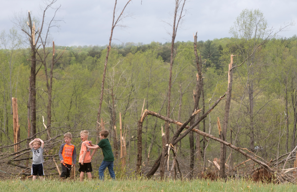 Damaged trees and children frame the property where Delores Anderson's house on Windy Ridge Road in Franklin County was leveled by a tornado Friday, April 19, 2019. From left to right, Bryce Powell, 3, Cooper Altice, 7, Jackson Anderson, 6, and Hunter Powell 8. (Heather Rousseau/The Roanoke Times via AP) Damaged trees and children frame the property where Delores Anderson's house on Windy Ridge Road in Franklin County was leveled by a tornado Friday, April 19, 2019. From left to right, Bryce Powell, 3, Cooper Altice, 7, Jackson Anderson, 6, and Hunter Powell 8. (Heather Rousseau/The Roanoke Times via AP)