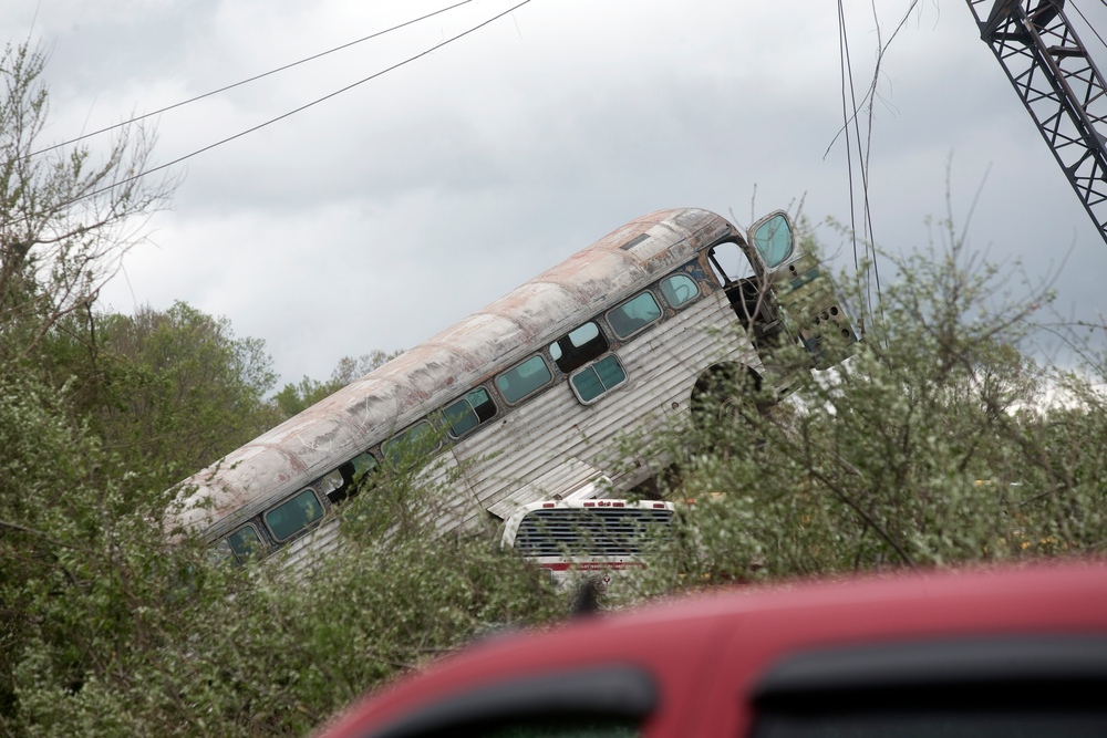 A bus that was taken by a tornado that touched down in Franklin County, Va., is viewed from Fishburn Mountiain Road, Friday, April 19, 2019. (Heather Rousseau/The Roanoke Times via AP) A bus that was taken by a tornado that touched down in Franklin County, Va., is viewed from Fishburn Mountiain Road, Friday, April 19, 2019. (Heather Rousseau/The Roanoke Times via AP)