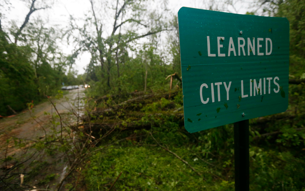 Fallen trees line the roads leading into the small community of Learned, Miss., Thursday, April 18, 2019. Several homes were damaged by fallen trees in the tree lined community. Strong storms again roared across the South on Thursday, topping trees and leaving more than 100,000 people without power across Mississippi, Louisiana and Texas. (AP Photo/Rogelio V. Solis) Fallen trees line the roads leading into the small community of Learned, Miss., Thursday, April 18, 2019. Several homes were damaged by fallen trees in the tree lined community. Strong storms again roared across the South on Thursday, topping trees and leaving more than 100,000 people without power across Mississippi, Louisiana and Texas. (AP Photo/Rogelio V. Solis)