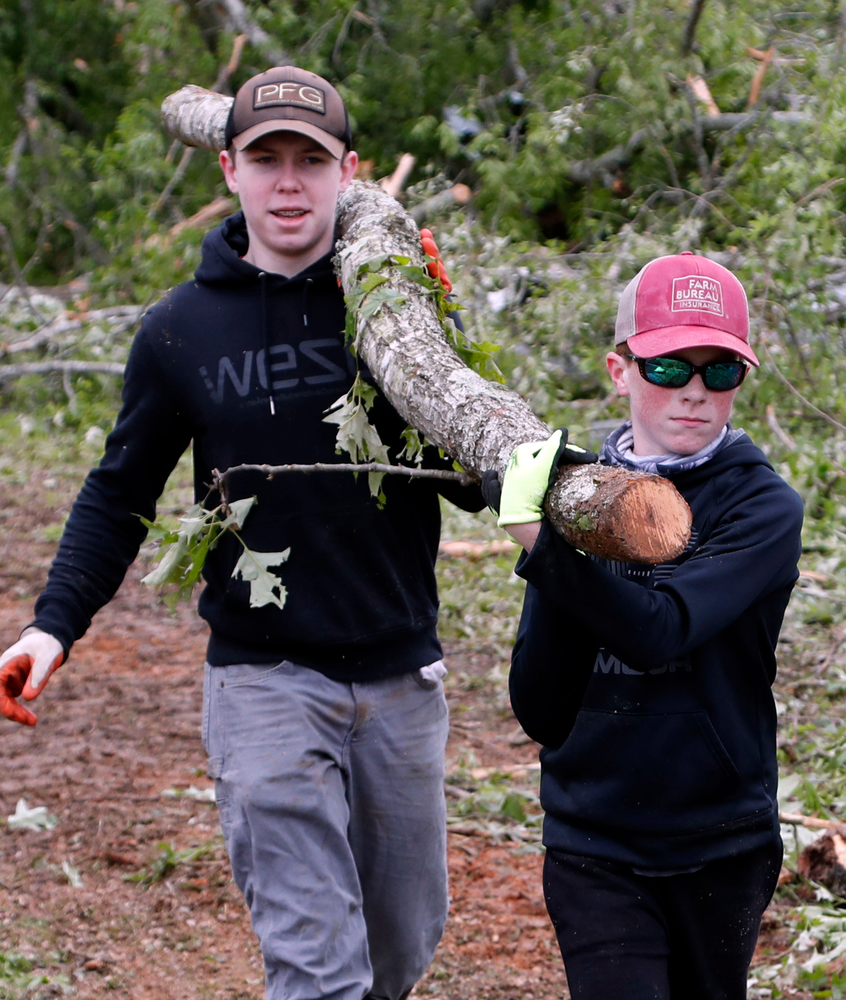 Justus Harvey, 16, left, and his friend Gage Lee, 13, both of Forest, Miss., work in tandem to remove a branch Friday, April 19, 2019, in Morton, Miss., as residents begin their cleanup from Thursday's possible tornado touchdown that heavily damaged many homes. Strong storms again roared across the South on Thursday, topping trees and leaving a variety of damage in Mississippi, Louisiana and Texas. (AP Photo/Rogelio V. Solis) Justus Harvey, 16, left, and his friend Gage Lee, 13, both of Forest, Miss., work in tandem to remove a branch Friday, April 19, 2019, in Morton, Miss., as residents begin their cleanup from Thursday's possible tornado touchdown that heavily damaged many homes. Strong storms again roared across the South on Thursday, topping trees and leaving a variety of damage in Mississippi, Louisiana and Texas. (AP Photo/Rogelio V. Solis)