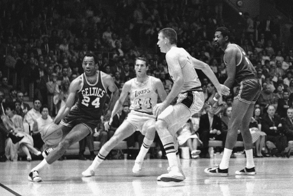 FILE - Boston Celtics John Havlicek on the way to a basket as New