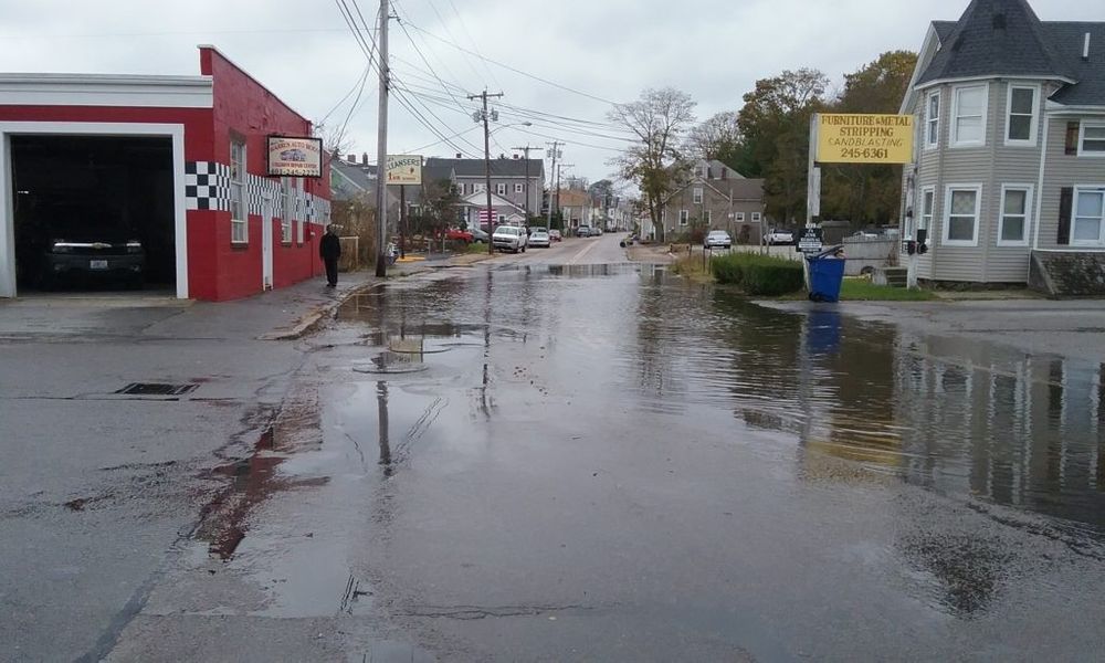 The section of Market Street in front of Warren Auto Body flooded by an especially high tide. Warren Planner Bob Rulli and Manager Kate Michaud often use this photo to highlight the town's vulnerability to sea level rise and storm surge.