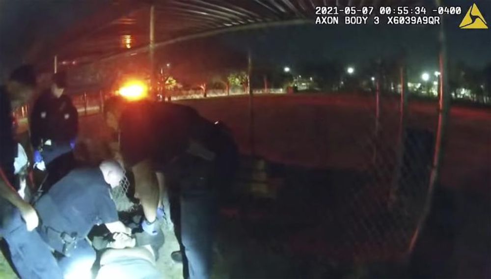 This photo taken from Providence Police body camera shows officers responding to a call Friday, May 7, 2021 of a man who was screaming outside in Providence, R.I. State authorities are investigating the case of the man who died after being handcuffed by police. Body camera video shows they spent more than ten minutes trying to calm him down before holding him down on his stomach for about 90 seconds while cuffing him behind his back. He then appeared to collapse, and was pronounced dead at a hospital. 